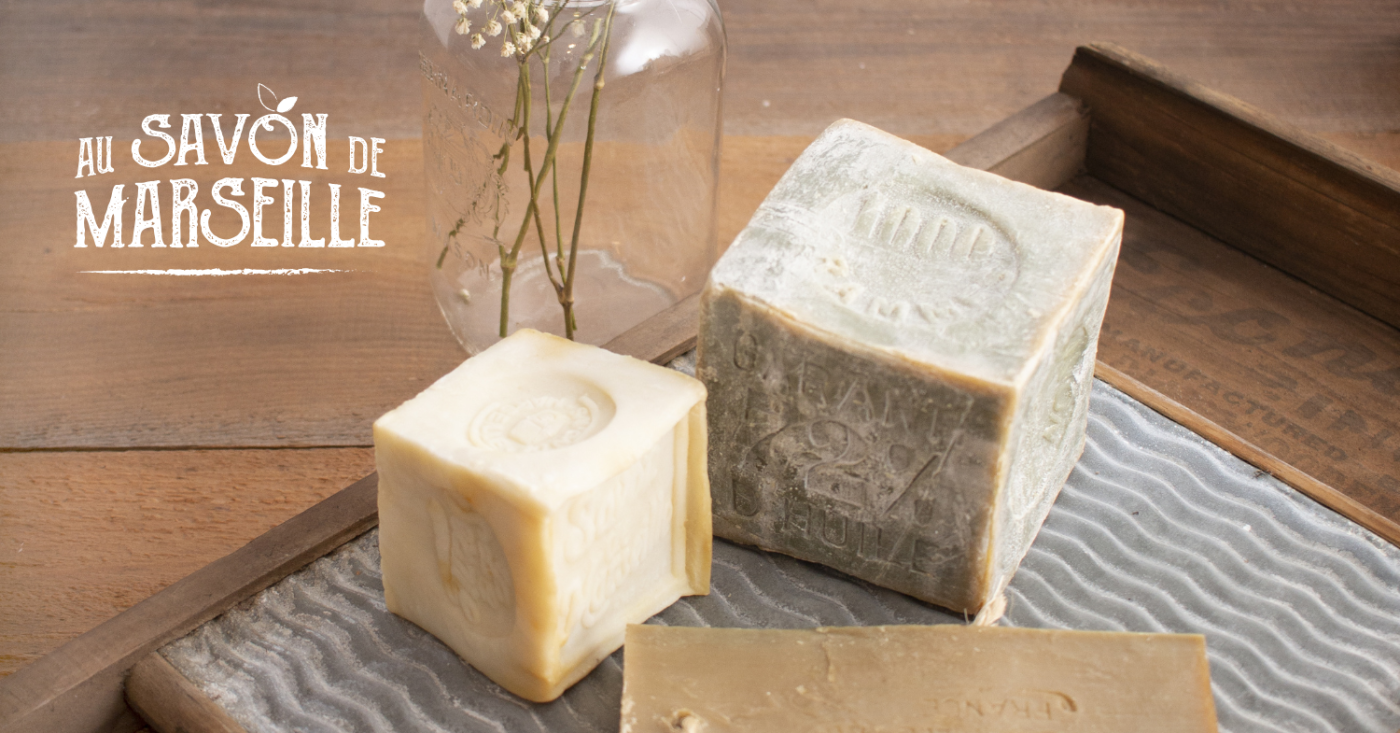 Logo d'Au Savon de Marseille avec cubes de savon de Marseille